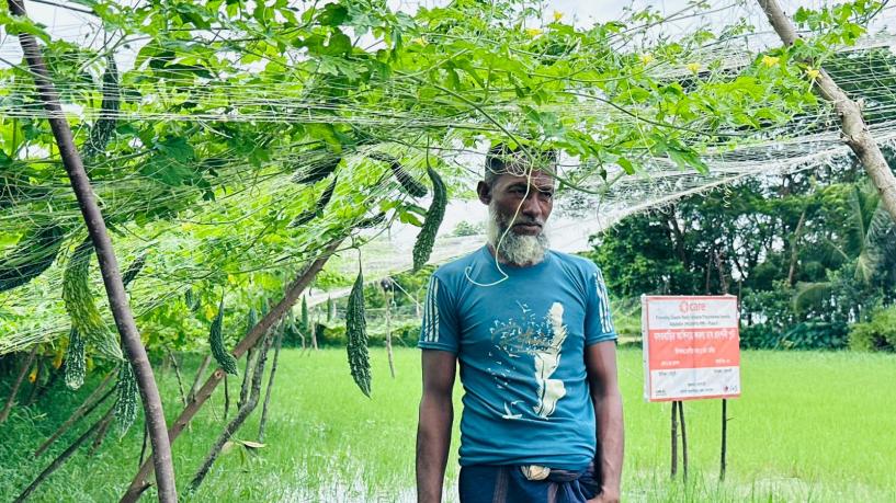 Farmer Monir is busy tending to his vegetable field.