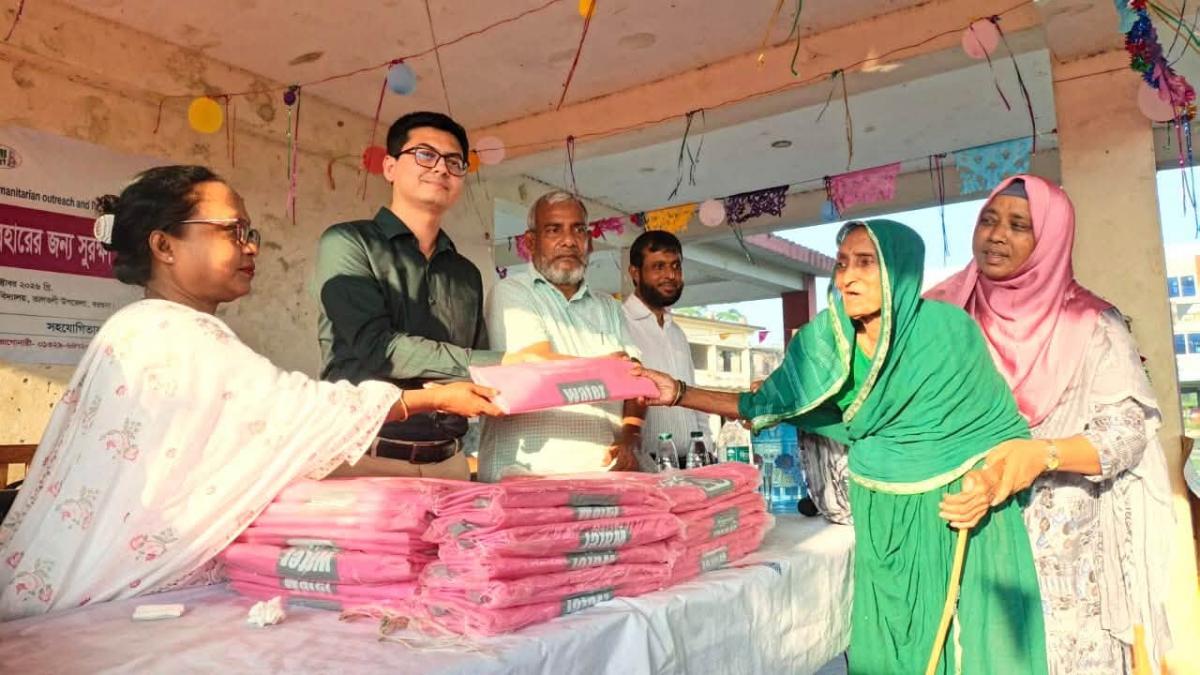 Mr. Atish Sarkar, the Upazila Nirbahi Officer (UNO) of Taltali, Barguna district, distributing the bags to marginalized women.