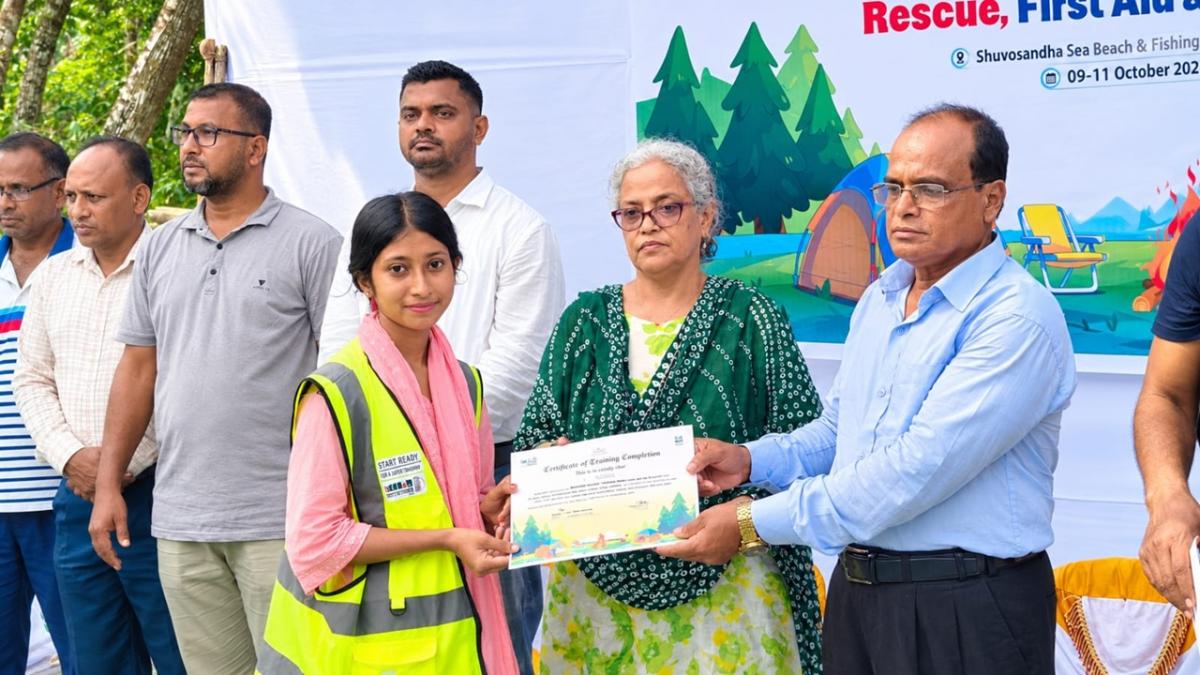Volunteers receiving certificates upon completion of training.