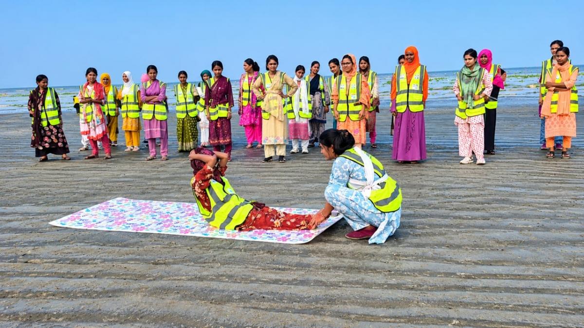 Volunteers learning various disaster response techniques during the training.